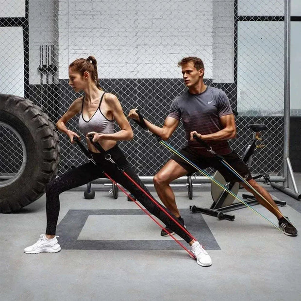 People exercising with fitness resistance bands in a gym setting.