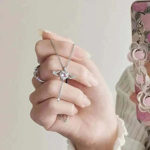 Heart Wings Necklace with delicate heart and wings, symbolizing love and freedom.