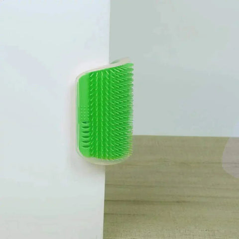 Cat Corner Groomer Brush mounted on wall, green bristles for self-grooming feline comfort.