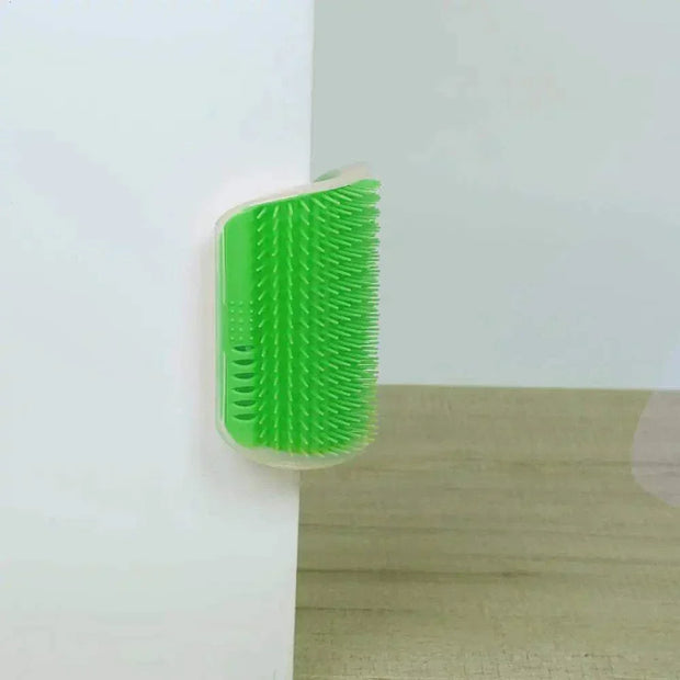 Cat Corner Groomer Brush mounted on wall, green bristles for self-grooming feline comfort.