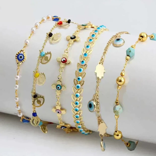 Charm bracelets with various colorful charms and designs.