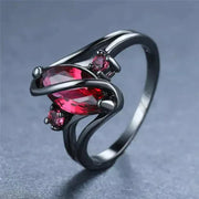 Elegant Crystal Ring with a dazzling red crystal centerpiece and intricate design.
