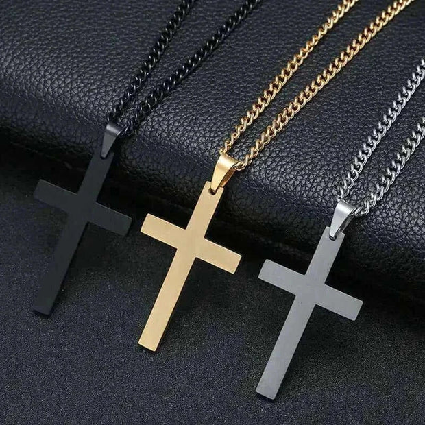 Elegant cross necklace in silver, gold, and black finishes, symbolizing faith and style.