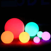 Waterproof Garden LED Lights Ball in vibrant colors illuminating an outdoor space.