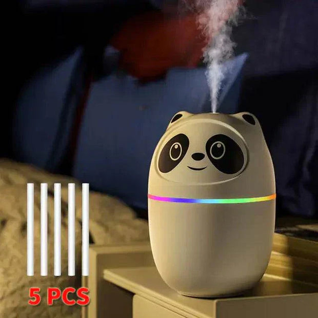 Cat humidifier with colorful night light, compact design, 250ml capacity, and USB power on a table.