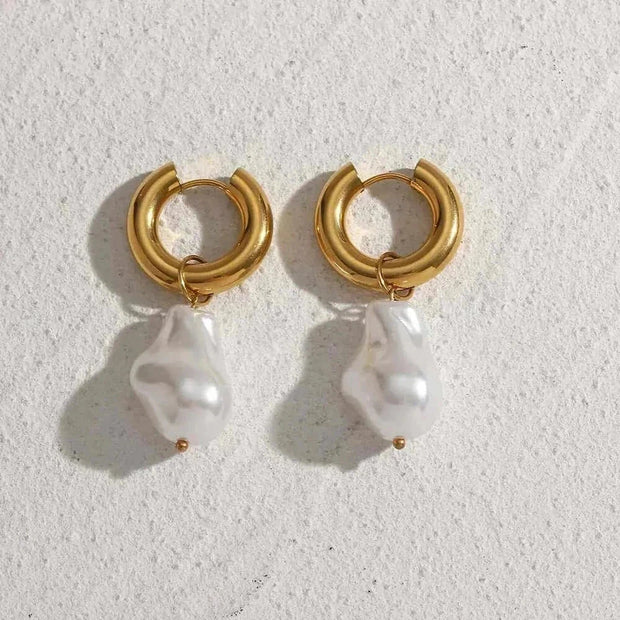 Elegant water drop earrings with gold hoops and pearl accents, perfect for any occasion.