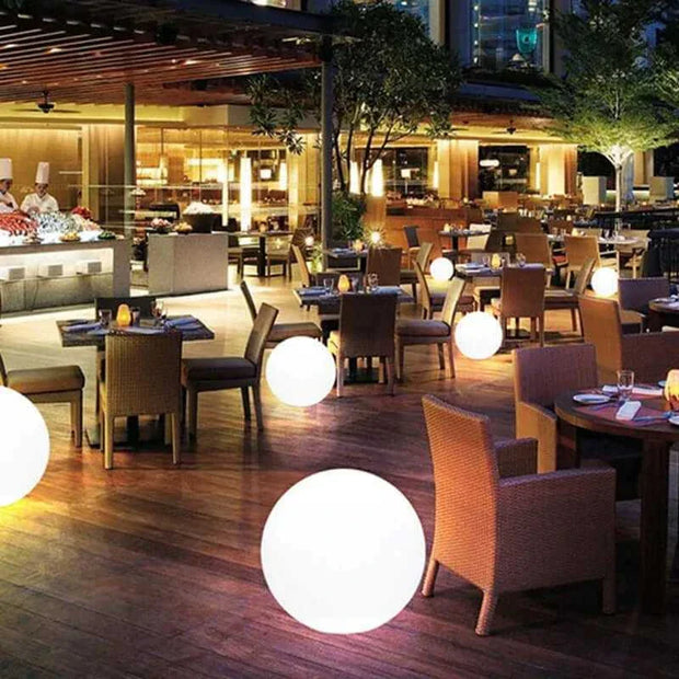 Waterproof Garden LED Lights Balls illuminating outdoor restaurant patio at night.