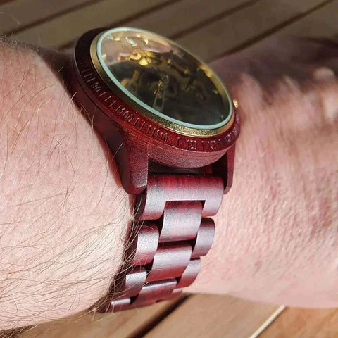 Wooden Mechanical Watch on wrist, showcasing intricate design and natural wood craftsmanship.