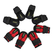 Waterproof Reflective Dog Boots in black and red with adjustable straps arranged in a circle.