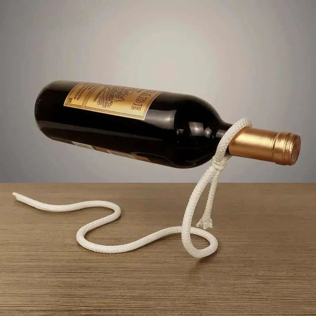 Suspended Rope Wine Bottle Holder displaying bottle with elegant design on wooden surface.