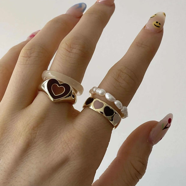 Creative Love Heart Ring on hand, showcasing unique heart design and high-quality alloy.